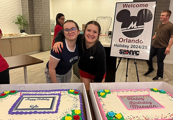 Students On Broadway red jacket team celebrating student birthday during orlando group tour